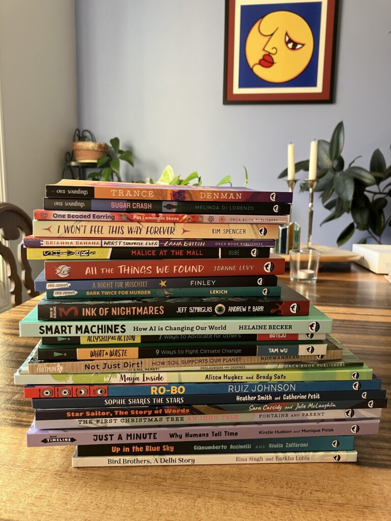 A stack of 23 children's and middle grade books.