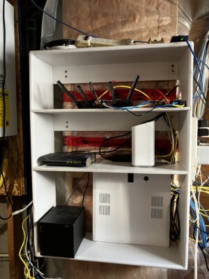 A ehile cabiinete with electrical appliances on it.